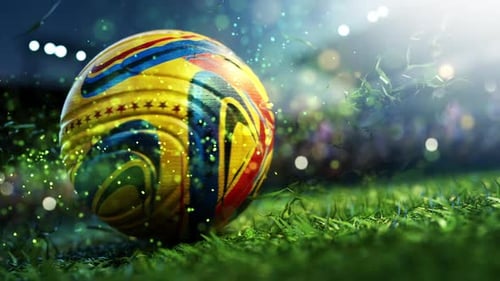 Vibrant soccer ball on sunlit stadium grass.