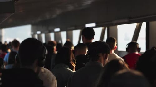 Crowd of People Walking in a Covered Walkway
