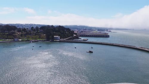 Aerial View of San Francisco Waterfront with Pier and Foggy Cityscape
