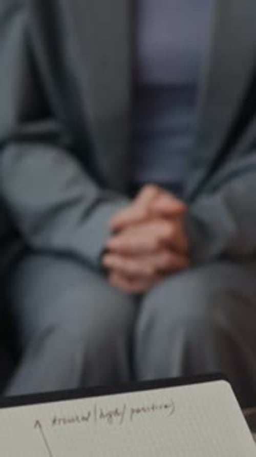 Psychologist Holding Emotion Chart Communicating with Patient during Session