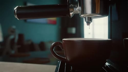 Pouring Coffee Stream From Machine in Cup Home Making Hot Espresso Using Filter Holder Flowing Fresh