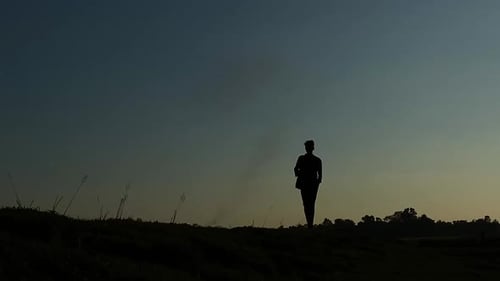 Mans silhouette walking. Sadness, Depression, Alone. Isolated person. Emotional setting.