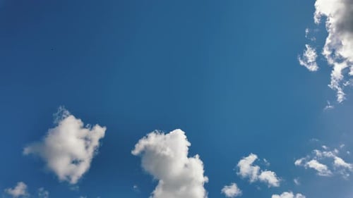 White Clouds on Clear Blue Sky Timelapse Texture Background