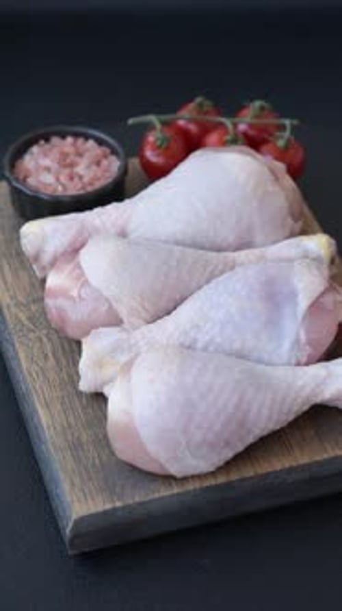 Raw chicken or turkey legs with salt, spices and herbs