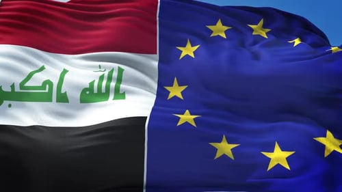 Iraq and European Union Flags Waving Against Blue Sky
