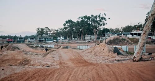 Dirt Bike Rider on Rural Motocross Track