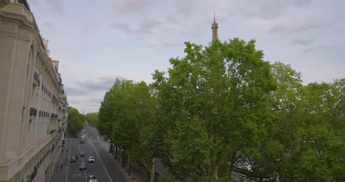 Aerial Drone Distant Sunset View of Tour Eiffel Tower and Seine River Bridge Traffic Cars Driving