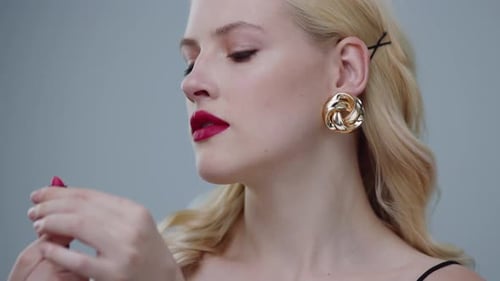 Blonde Woman with Lipstick in Studio