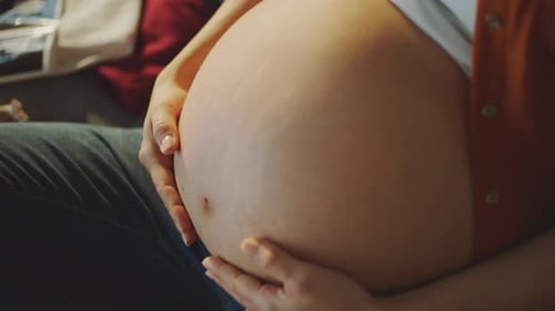 Pregnant Belly Close-Up: A Tender Moment
