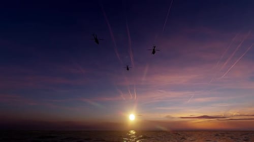 Military Helicopters Flying Over Sunset Ocean