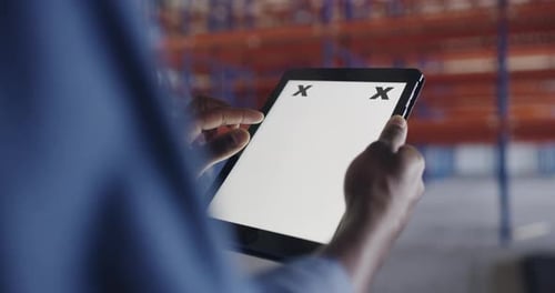 An unrecognizable man using a digital tablet