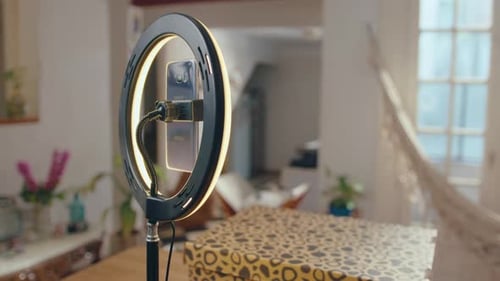 Phone with Ring Light Ready for Vlogging in the Living Room