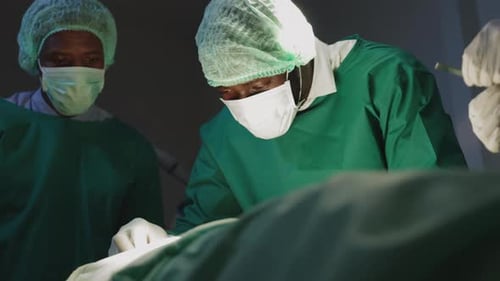 Surgeons Performing Delicate Procedure in Hospital Operating Room