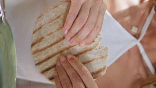 Woman Hands Holding Pita Dinning in Restaurant Closeup Lady Eating Vertical