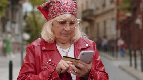 Senior Woman Using Credit Bank Card Smartphone While Transferring Money Purchases Online Shopping