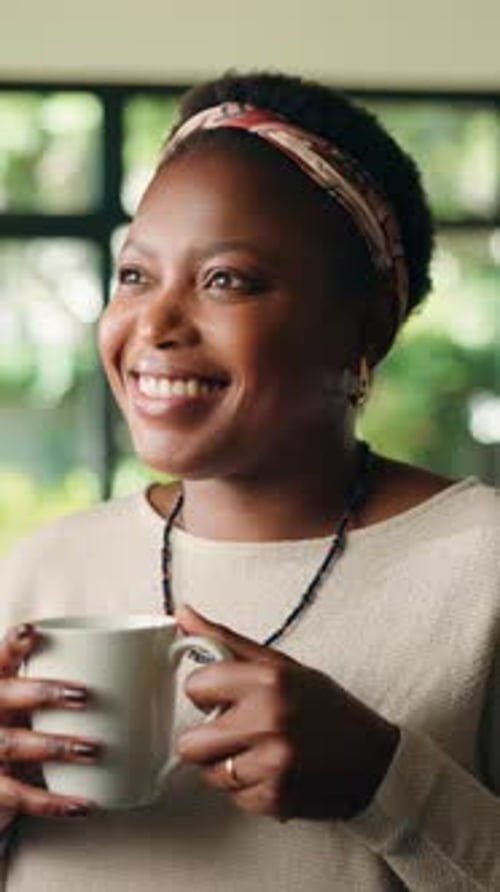 Woman Enjoying Hot Beverage in Cozy Home