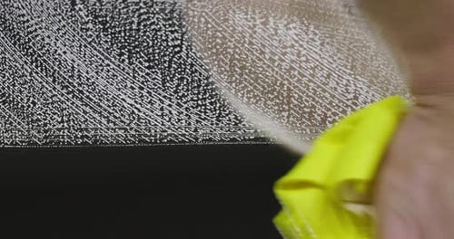 Close up of a cloth that cleans a dark mirror after only one pass. A cloth suitable for domestic c