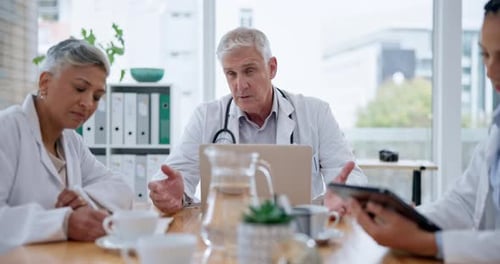 Medical, discussion and group of doctors in a meeting in the hospital boardroom for a treatment