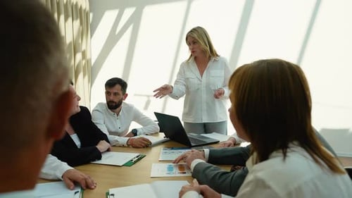 Business meeting in office with diverse colleagues