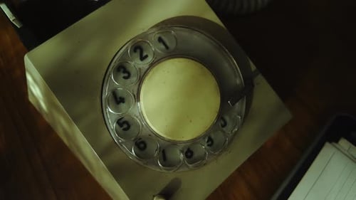 Callers Finger dialling number on rotary telephone landline CLOSE-UP