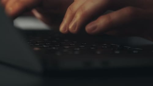 Fingers Typing on a Laptop Keyboard Close Up