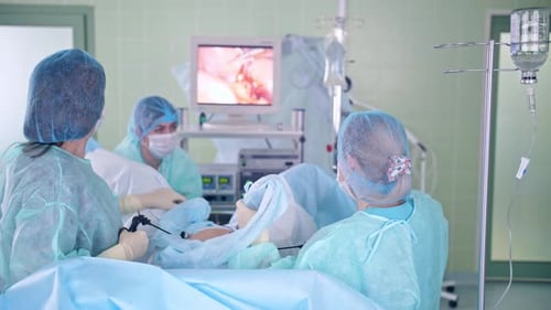 Surgeons Performing Laparoscopic Surgery in Operating Room
