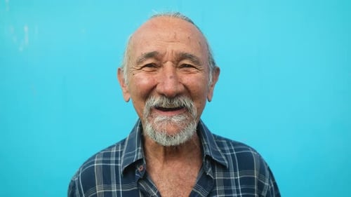 Happy senior man having fun looking and smiling into the camera - Elderly people lifestyle concept