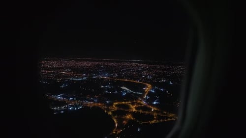 Canberra City Lights Seen From Airplane Window at Night