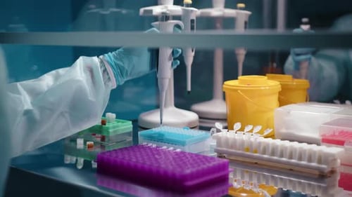 Scientist uses Pipette in Sterile Laboratory Environment