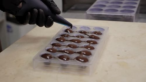 Filling Chocolate Mold with Melted Chocolate
