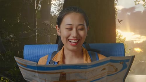 Close Up Of Asian Female Hiker Looking At The Map Then Looking Around While Exploring Forest Nature