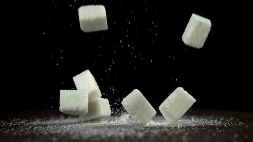 Sugar Cubes Fall on the Table Filmed on a Highspeed Camera at 1000 Fps
