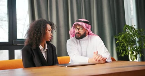 Successful Confident Muslim Man Wearing Keffiyeh Talking with Beautiful Woman Working Together