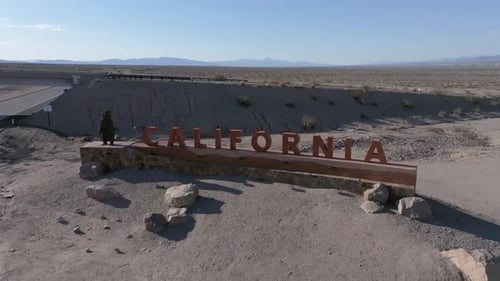 Aerial View of California Welcome Sign in Desert