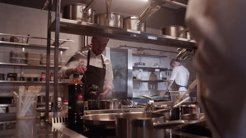 Chefs Cooking in Commercial Kitchen