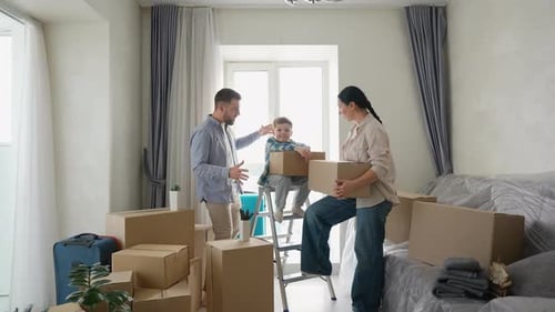 Frustrated Parents Arguing While Moving to New Home