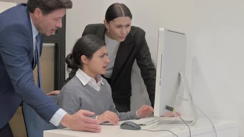 Distraught Worker Being Supervised in Office Setting