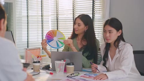 Group of Asian businessman and businesswoman working in the office.