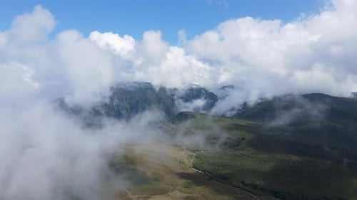 Aerial View of Mountain Peaks with Clouds