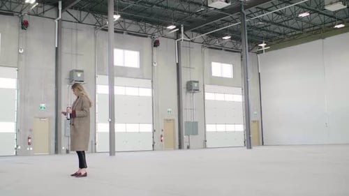 Warehouse Owner Texting on Phone