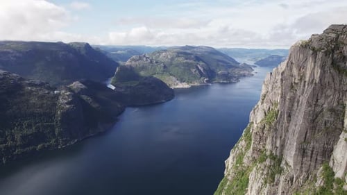 Aerial View Of Norway's Breathtaking Mountain Landscape And Winding River