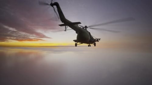 Military Helicopter Flying Above Clouds at Sunset