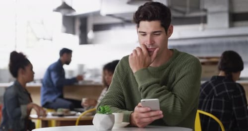 Laughing, phone or happy man in cafe with a meme on social media or website notification