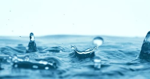 Rain water drops falling in super slow motion.