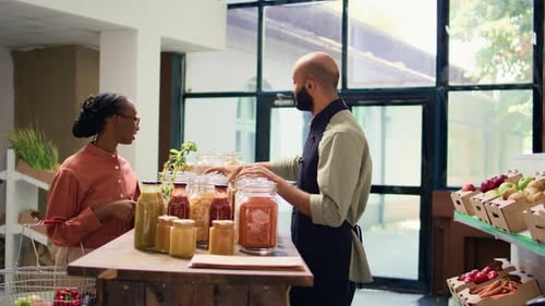 Shopkeeper Serving Customer at Local Store