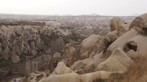 Panning Shot of Beautiful Mountain Range at Cappadocia Valley Against Sky