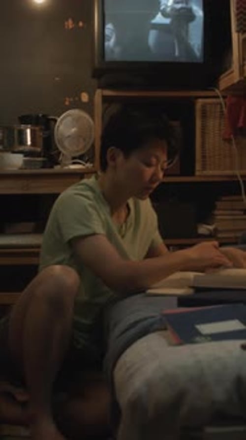 Asian Student Preparing for University Exam in Capsule Flat