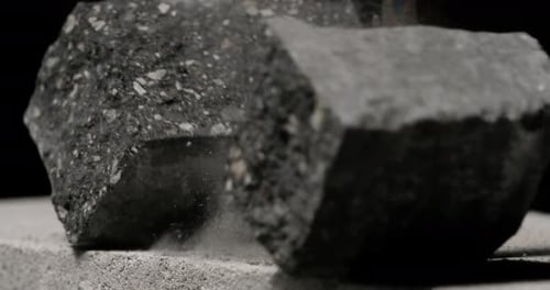 Hammer Crushing Concrete Block in Slow Motion