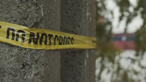 Yellow Tape Blocking Area in Urban Setting