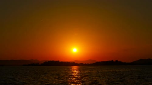 Beautiful Sunset Over Calm Waters at Twilight